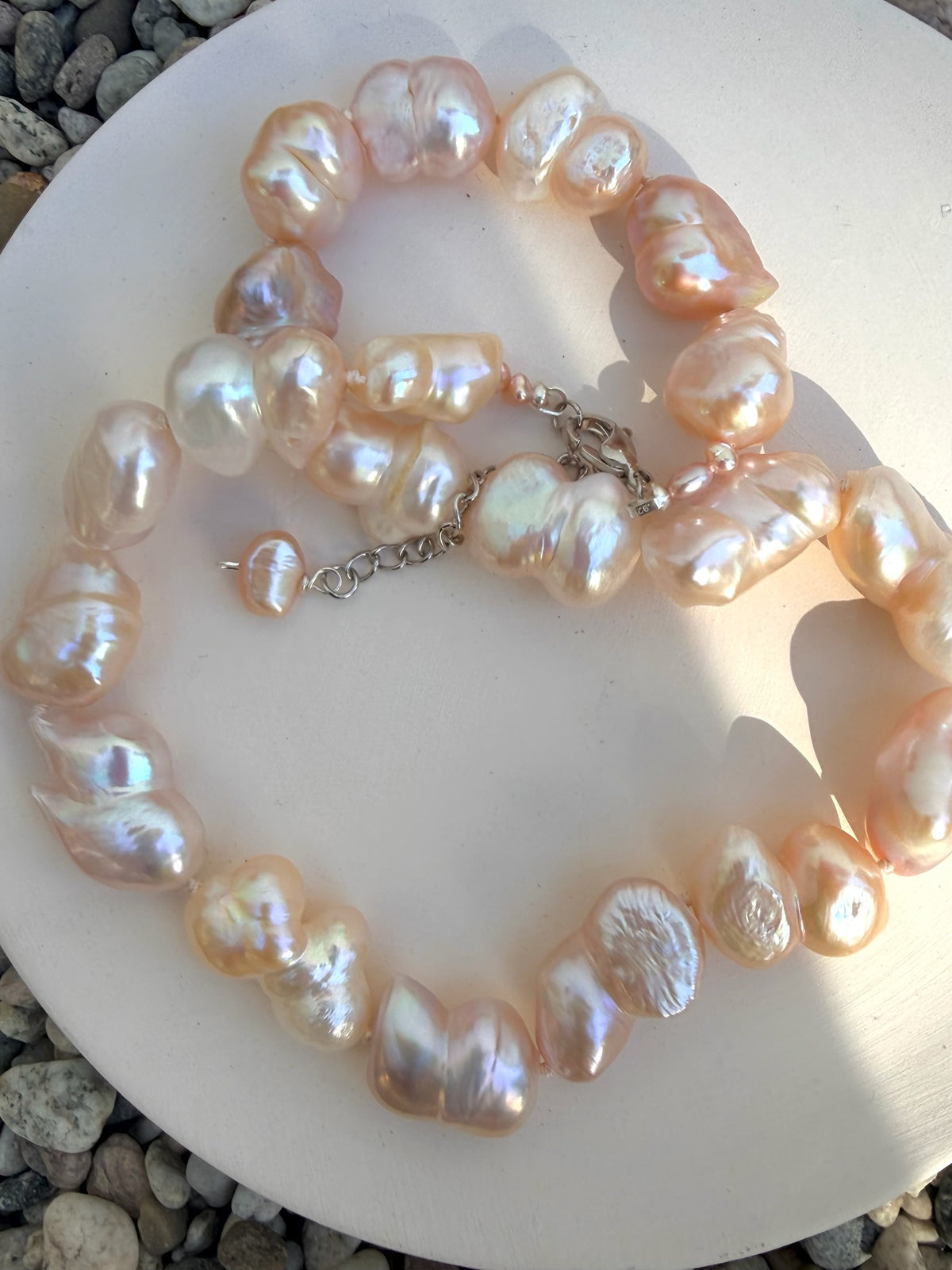 TNT Designs Jewels handcrafted statement necklace featuring iridescent blush-pink irregular baroque pearls.
