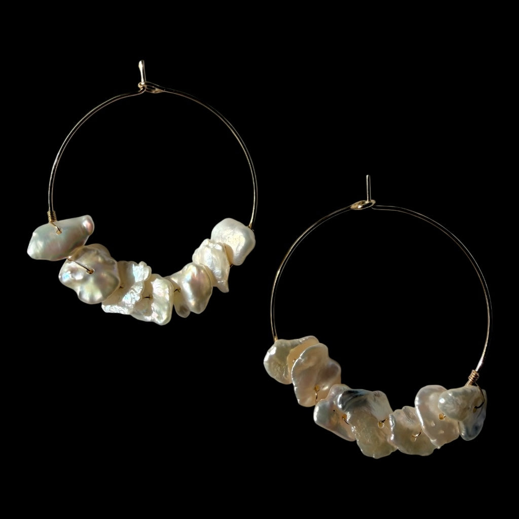 TNT Designs Jewels gold hoop earrings featuring lustrous, irregular baroque pearls for a modern bohemian look.